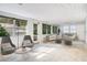 Bright, airy living room with tile floors, large windows, and comfortable seating area at 7200 Grace Rd, Orlando, FL 32819