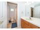 Bathroom featuring a single sink vanity with a white countertop and a shower and tub combo at 11313 Via Andiamo, Windermere, FL 34786