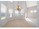 View of formal dining area with chandelier and lots of natural light at 11313 Via Andiamo, Windermere, FL 34786