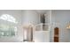 This view of the foyer showcases the soaring ceilings, natural light and stairs to the second floor at 11313 Via Andiamo, Windermere, FL 34786