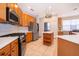 Spacious kitchen with stainless steel appliances, a gas range, and a central island with storage at 11313 Via Andiamo, Windermere, FL 34786