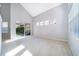 A bright living room featuring soaring ceilings, lots of natural light and access to the backyard at 11313 Via Andiamo, Windermere, FL 34786
