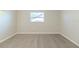 Simple bedroom with neutral walls and carpet at 2220 Menomonee Ct, Orlando, FL 32818