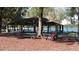 Park gazebo with picnic tables overlooking a lake at 3563 S Saint Lucie Dr, Casselberry, FL 32707