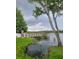 Wooden dock extending into a calm lake, under a cloudy sky at 3563 S Saint Lucie Dr, Casselberry, FL 32707