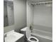 Bathroom features a sink, toilet, and shower-tub combo at 4617 Frisco Cir, Orlando, FL 32808