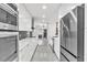 Gourmet kitchen featuring stainless steel appliances, marble countertops, and contemporary design at 1315 Wheeler Rd, Apopka, FL 32703