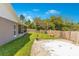 Lush backyard with mature trees and a privacy fence at 45 Sackett Rd, Debary, FL 32713