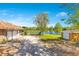 Spacious two-car garage with a view of a tranquil lake and convenient storage sheds at 45 Sackett Rd, Debary, FL 32713
