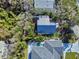 An overhead view of a property showcasing the backyard, modern roof, and proximity to a pool area at 6353 River Rd, New Smyrna Beach, FL 32169