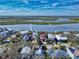 Aerial view of the home with nearby intercoastal waterway, showcasing prime waterfront neighborhood at 6353 River Rd, New Smyrna Beach, FL 32169