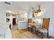 Bright open-concept living area with kitchen access and a cozy dining nook at 6353 River Rd, New Smyrna Beach, FL 32169
