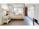 Inviting main bedroom with a four-poster bed, natural light, and tranquil ambiance at 6353 River Rd, New Smyrna Beach, FL 32169