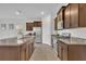 Kitchen with island, stainless steel appliances, and granite countertops at 7833 Oak Reflection Loop, Davenport, FL 33837