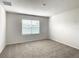 Bright bedroom featuring a window and carpet at 791 Chinoy Rd, Davenport, FL 33837
