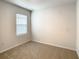 Spacious bedroom with large window and carpet at 791 Chinoy Rd, Davenport, FL 33837