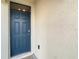 Modern dark blue front door with a glass window above at 791 Chinoy Rd, Davenport, FL 33837