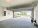 Spacious garage with open view of the neighborhood at 791 Chinoy Rd, Davenport, FL 33837