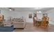 Inviting living room with a smooth transition into the dining area at 2325 Crossandra St, Mascotte, FL 34753