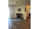 Cozy sitting area featuring a decorative fireplace and access to the patio at 2325 Crossandra St, Mascotte, FL 34753
