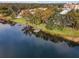 Aerial view of lakeside community with lush landscaping, dock and waterfront views at 320 Lakeview St # 123, Orlando, FL 32804