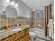 Bathroom with granite counters, tile backsplash, and a shower and tub combination at 320 Lakeview St # 123, Orlando, FL 32804