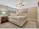 Bedroom with neutral colors, a tufted headboard, and ambient lighting at 320 Lakeview St # 123, Orlando, FL 32804