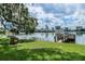 Lakeside view featuring a grassy shore, pier and city skyline at 320 Lakeview St # 123, Orlando, FL 32804
