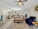 Comfortable living room area featuring an accent chair and mirror wall at 320 Lakeview St # 123, Orlando, FL 32804