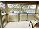 Private balcony overlooking a grassy backyard with trees and neighboring homes at 3602 Calabria Ave, Davenport, FL 33897