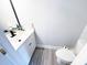 Small half bathroom with a white vanity and toilet at 3602 Calabria Ave, Davenport, FL 33897