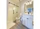 Modern bathroom with a glass shower and white vanity at 3602 Calabria Ave, Davenport, FL 33897