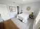 Bright bedroom with a queen bed, nightstand, and a walk-in closet at 3602 Calabria Ave, Davenport, FL 33897
