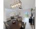 Bright dining room features a large table and chairs, and is open to the living room at 3602 Calabria Ave, Davenport, FL 33897