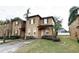 Two-story townhome with a paved driveway and landscaped lawn at 3602 Calabria Ave, Davenport, FL 33897