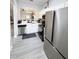 Modern kitchen with stainless steel appliances and white cabinets at 3602 Calabria Ave, Davenport, FL 33897