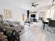 Spacious living room with L-shaped sofa and access to a backyard patio at 3602 Calabria Ave, Davenport, FL 33897