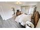 Main bedroom with king bed, ensuite bathroom, and balcony access at 3602 Calabria Ave, Davenport, FL 33897