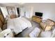 Spacious main bedroom with king-size bed and sitting area at 3602 Calabria Ave, Davenport, FL 33897