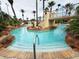 Lazy river with a bridge and rock features at 3602 Calabria Ave, Davenport, FL 33897