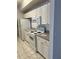 Functional kitchen featuring white appliances and ample cabinet space at 5542 Metrowest Blvd # 206, Orlando, FL 32811
