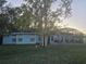 Ranch style home with screened patio and large backyard at 713 Swan Way, Kissimmee, FL 34758