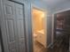 Well-lit bathroom with a shower-tub combo, single sink vanity, and neutral decor at 713 Swan Way, Kissimmee, FL 34758