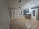 Bright dining room features tile flooring and access to kitchen at 713 Swan Way, Kissimmee, FL 34758
