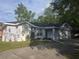 Charming single-story home featuring manicured landscaping and an attached two car garage at 713 Swan Way, Kissimmee, FL 34758