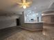 Kitchen features a breakfast bar and white cabinets at 713 Swan Way, Kissimmee, FL 34758