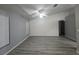 Living room with wood-look floors and ceiling fan at 713 Swan Way, Kissimmee, FL 34758