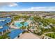 Aerial view of community pool and surrounding homes at 826 Paradise Dr, Davenport, FL 33897