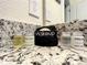 Clean bathroom with granite countertop and complimentary toiletries at 826 Paradise Dr, Davenport, FL 33897