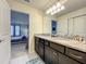 Double vanity bathroom with granite countertop at 826 Paradise Dr, Davenport, FL 33897